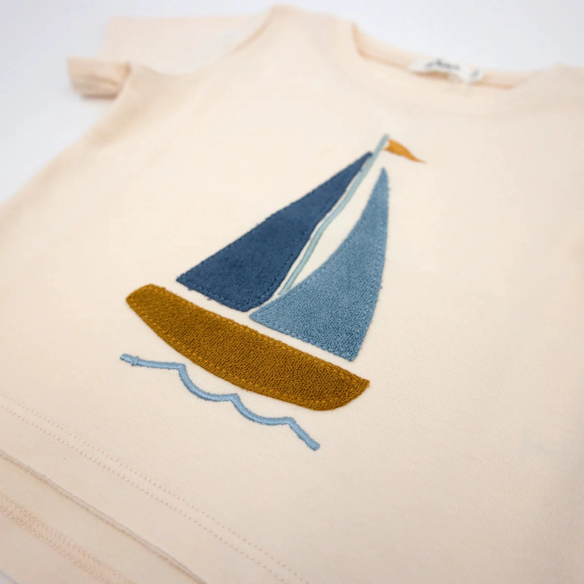Metro Edge OdorControl Treatment Raw Edge Short Sleeve Cotton Slub Tee - Denim Sailboat Applique - Cashew